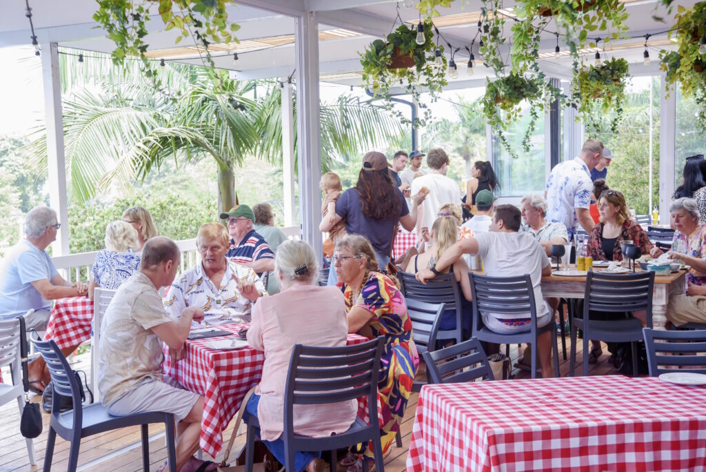 Members share a meal on the Kloof Country Club veranda.